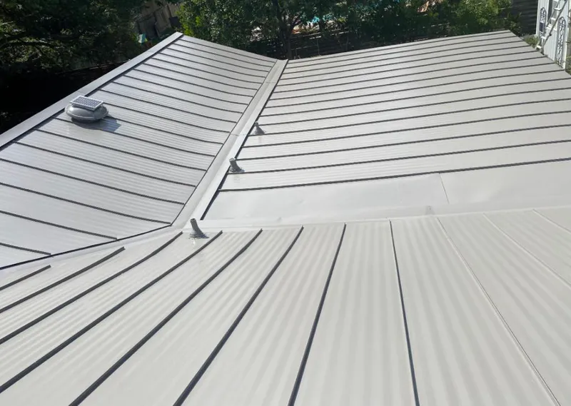 Solar attic fan installed on a metal roof for Roof Ventilation in South Whittier