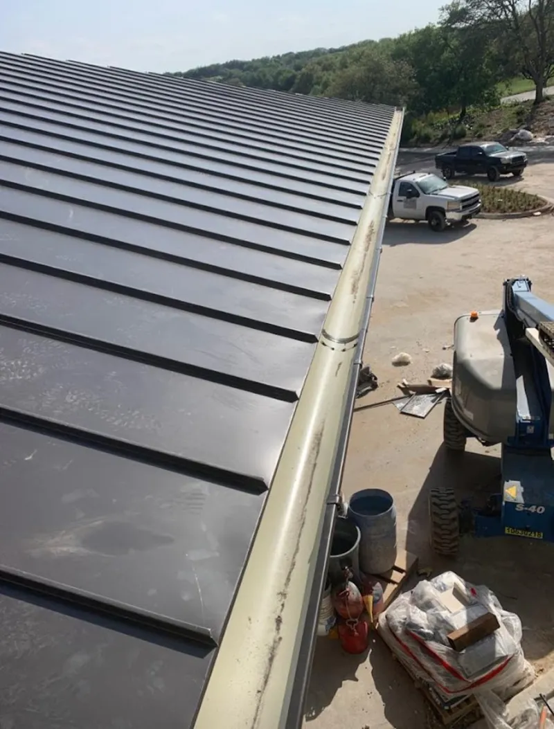 Standing seam panel and gutter detail on a metal roofing jobsite in South Whittier